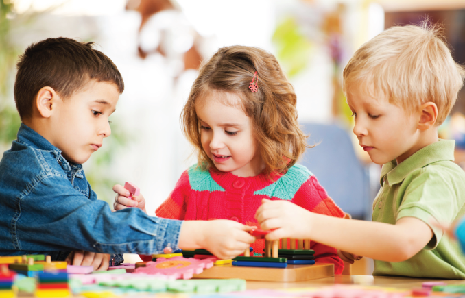 Toddlers playing in the school on display