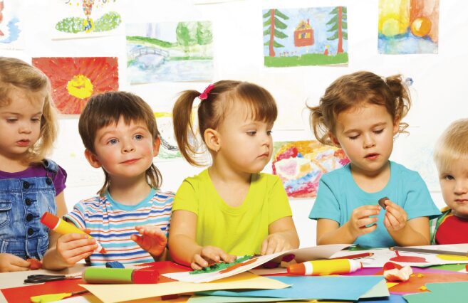 Young children creating art together